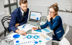 Startup team reviewing analytics and growth charts to improve online reputation and business performance