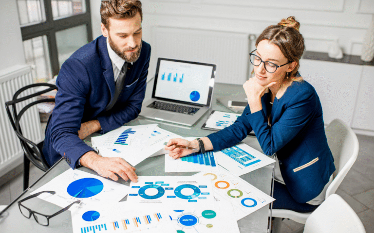 Startup team reviewing analytics and growth charts to improve online reputation and business performance