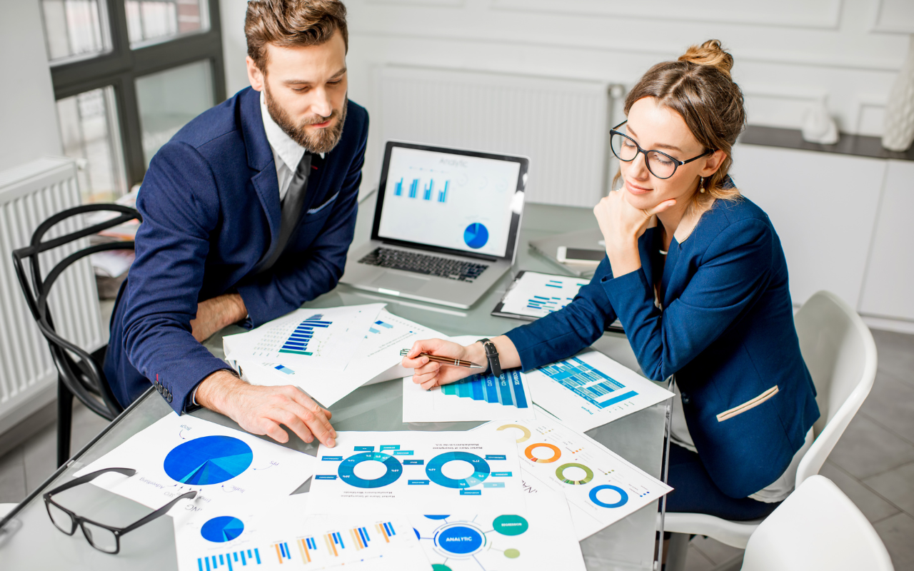 Startup team reviewing analytics and growth charts to improve online reputation and business performance